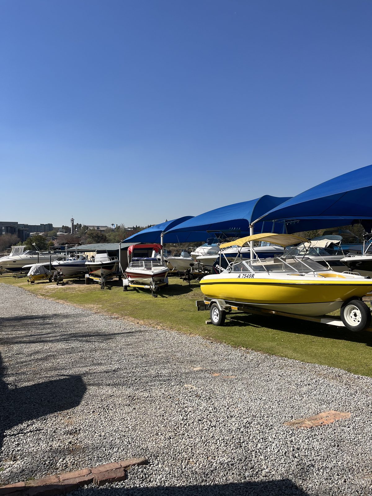 Boats under shade netting in the Leisure Marine yard