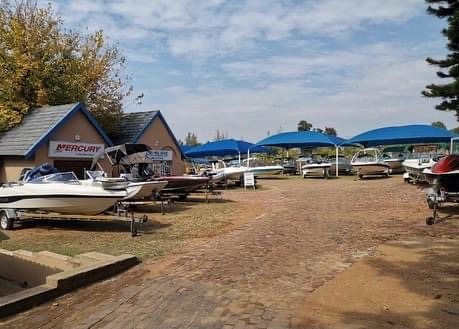 The Leisure Marine yard with boats under shade netting